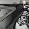 This image is a closeup front-side view of the Rancilio Classe 7 espresso machine steam wand, steam c-lever, gauge and side panel. 